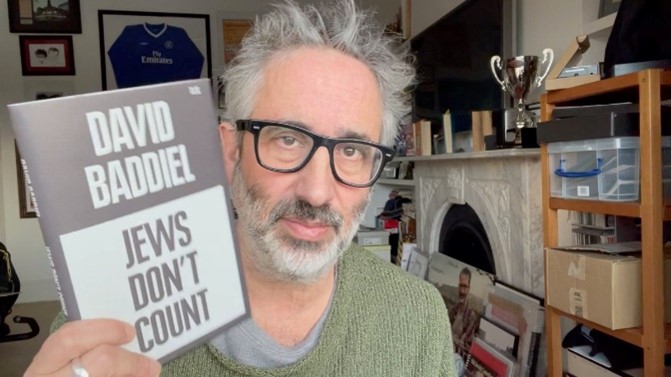 A confused aging Jew with his "book"